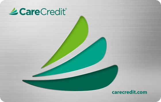 CareCredit payment card featuring green curved design and logo for dental financing.